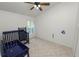 Bright bedroom featuring a ceiling fan, window and blue Bedroom furniture set at 16804 Hawkridge Rd, Lithia, FL 33547