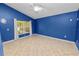 Bright bedroom with tile floors, ceiling fan, and a sun-filled window to make the space comfortable at 16804 Hawkridge Rd, Lithia, FL 33547