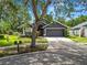 Charming one-story home with a two car garage, mature trees, and inviting curb appeal at 16804 Hawkridge Rd, Lithia, FL 33547