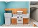 Efficient kitchen featuring white appliances, oak cabinets, and white tile backsplash at 16804 Hawkridge Rd, Lithia, FL 33547