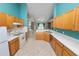 Open kitchen featuring oak cabinets, stainless steel appliances, and ample counter space at 16804 Hawkridge Rd, Lithia, FL 33547