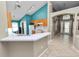 Open floor plan from the kitchen showcasing the breakfast bar and entry at 16804 Hawkridge Rd, Lithia, FL 33547