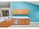Bright kitchen featuring wooden cabinetry and stainless steel appliances with tiled floor at 16804 Hawkridge Rd, Lithia, FL 33547