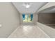 Spacious living area featuring neutral walls, tile flooring, and ample natural light at 16804 Hawkridge Rd, Lithia, FL 33547