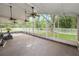 Large, open screened porch with white vinyl fence, great light and privacy at 16804 Hawkridge Rd, Lithia, FL 33547