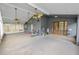 Large screened porch featuring exercise equipment and multiple ceiling fans at 16804 Hawkridge Rd, Lithia, FL 33547