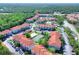 A large condominium complex with a pool, tennis court, and ample parking nestled in a wooded area at 18001 Richmond Place Dr # 337, Tampa, FL 33647