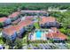 Aerial view of condo community featuring a pool, clubhouse, and well-maintained landscaping, ideal for relaxed living at 18001 Richmond Place Dr # 337, Tampa, FL 33647