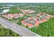 Overhead view of the multi-Gathering building and parking lot near a highway at 18001 Richmond Place Dr # 337, Tampa, FL 33647