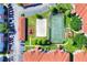 Aerial view showcasing the community's tennis and volleyball courts amidst lush greenery at 18001 Richmond Place Dr # 337, Tampa, FL 33647