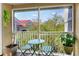 Cozy balcony with outdoor seating and a view of the tree-lined neighborhood at 18001 Richmond Place Dr # 337, Tampa, FL 33647