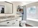 Well-lit bathroom with a marble vanity, modern fixtures, and a shower and tub at 18001 Richmond Place Dr # 337, Tampa, FL 33647