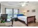 This is a well-lit bedroom, featuring a ceiling fan and an office space by the window at 18001 Richmond Place Dr # 337, Tampa, FL 33647