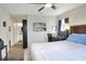 Bright bedroom with a ceiling fan and a workspace by the window and an attached bathroom at 18001 Richmond Place Dr # 337, Tampa, FL 33647