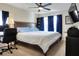 Well-lit bedroom featuring large bed, desk, and ceiling fan for a comfortable living space at 18001 Richmond Place Dr # 337, Tampa, FL 33647