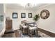 Dining space with modern table and a decorative clock, conveniently located near the kitchen at 18001 Richmond Place Dr # 337, Tampa, FL 33647