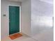 Apartment entryway featuring a vibrant green door with a welcome mat at 18001 Richmond Place Dr # 337, Tampa, FL 33647