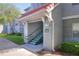 Building 300 exterior showing condo entrance with stairs and unit numbers, offering a welcoming approach at 18001 Richmond Place Dr # 337, Tampa, FL 33647