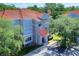 A condo building with gray facade and a red tile roof provides a cozy and attractive exterior at 18001 Richmond Place Dr # 337, Tampa, FL 33647