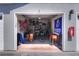 Open garage filled with assorted stored items, wall decorations, and a vintage side table at 18001 Richmond Place Dr # 337, Tampa, FL 33647