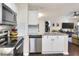 Updated kitchen with stainless steel appliances and granite countertops that opens to the living area at 18001 Richmond Place Dr # 337, Tampa, FL 33647