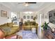 A comfortable living room with plush sofas, dark hardwood floors, and ample natural light at 18001 Richmond Place Dr # 337, Tampa, FL 33647