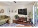 Cozy living room showcasing stylish furnishings, a modern TV, and natural lighting at 18001 Richmond Place Dr # 337, Tampa, FL 33647
