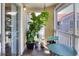 Inviting screened-in patio with plants, stylish furniture, and views of the community at 18001 Richmond Place Dr # 337, Tampa, FL 33647