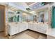 Large bathroom with white double sink vanity, large mirror and unique decor at 1909 Masters Way, Plant City, FL 33566