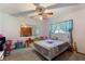 Bedroom with bed and closet, ceiling fan, and mirror at 1909 Masters Way, Plant City, FL 33566