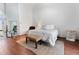 Serene bedroom with natural light, wood floors, and minimalist decor at 1909 Masters Way, Plant City, FL 33566