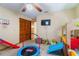 Bedroom with various toddler toys, a TV and a ceiling fan at 1909 Masters Way, Plant City, FL 33566