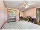 Cozy bedroom with mirrored closet doors and a ceiling fan with lights for a comfortable ambiance at 1909 Masters Way, Plant City, FL 33566