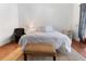 Inviting bedroom with soft textures, warm wood floors, and neutral color palette at 1909 Masters Way, Plant City, FL 33566