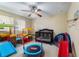 Bedroom with various toddler toys and a ceiling fan at 1909 Masters Way, Plant City, FL 33566