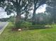 Tanglewood gated community entrance with brick columns and lush landscaping at 1909 Masters Way, Plant City, FL 33566