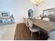 Elegant dining room featuring a large wooden table, upholstered chairs, and a stylish chandelier, ideal for gatherings at 1909 Masters Way, Plant City, FL 33566