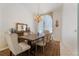 Charming dining area featuring a wooden table, comfortable seating, and elegant decor at 1909 Masters Way, Plant City, FL 33566