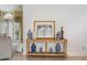 Inviting foyer featuring a stylish console table adorned with decorative vases and elegant artwork at 1909 Masters Way, Plant City, FL 33566