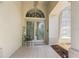 Elegant front door with decorative glass, a tiled entryway, and a charming 'Welcome' sign at 1909 Masters Way, Plant City, FL 33566