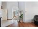 Entryway with high ceilings, tiled floors, and an arched doorway view of the kitchen at 1909 Masters Way, Plant City, FL 33566