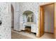 Hallway with built-in vanity and storage, and archway mirrors at 1909 Masters Way, Plant City, FL 33566