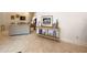 Bright living room showcasing tile floors, a console table with decor, and comfortable seating, perfect for relaxation at 1909 Masters Way, Plant City, FL 33566