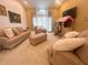 Inviting living room featuring comfortable sofas, a play area, and soft lighting, perfect for Gathering time at 1909 Masters Way, Plant City, FL 33566