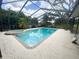 Screened in pool and hot tub offer relaxing outdoor enjoyment at 1909 Masters Way, Plant City, FL 33566