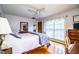 Bedroom featuring hardwood floors, neutral walls, and natural light at 2223 Wildwood Hollow Dr, Valrico, FL 33596