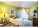 Inviting bedroom with a twin bed and floral curtains at 2223 Wildwood Hollow Dr, Valrico, FL 33596
