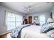 Light-filled bedroom with a large window and a ceiling fan at 2223 Wildwood Hollow Dr, Valrico, FL 33596