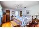 Bright bedroom boasts hardwood floors, neutral walls, and a ceiling fan at 2223 Wildwood Hollow Dr, Valrico, FL 33596