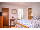 Comfortable bedroom features a desk, painting and a view of the ensuite bathroom at 2223 Wildwood Hollow Dr, Valrico, FL 33596